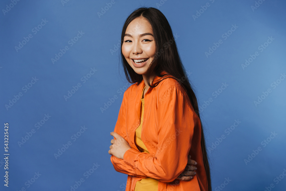Young asian woman wearing t-shirt smiling while looking at camera Young asian woman wearing t-shirt smiling while looking at camera
