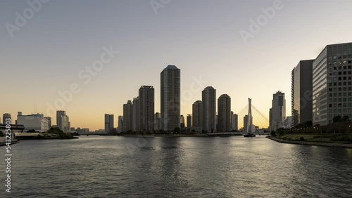 Dusk to night timelapse of High rise condominium in Tokyo Sumida river area. photo