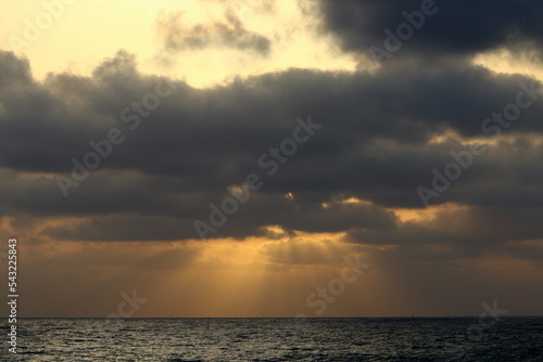 The sun sets below the horizon on the Mediterranean Sea in northern Israel.