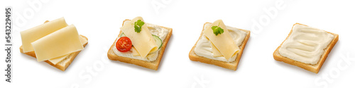 Set of toasts with melted and sliced cheese on bread. Assortment of sandwiches with gouda cheese, tomatoes, cucumber isolated on a white background with clipping path. Top view.