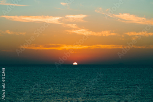 Seascape in early morning  sunrise over sea. Nature landscape. sunshine over the horizon with blue cloudy sky