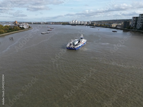 Woolwich ferry crossing River Thames London UK drone aerial view