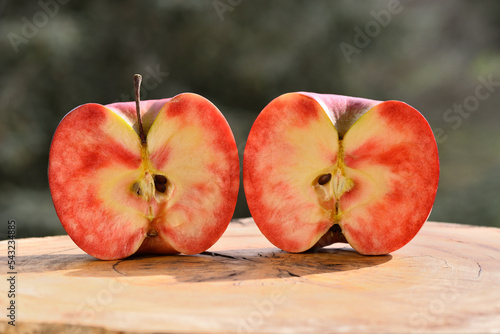 Close up of apple type with red, white, yellow and pink pulp