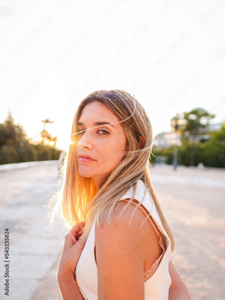Female standing in park during sunset Female standing in park during sunset