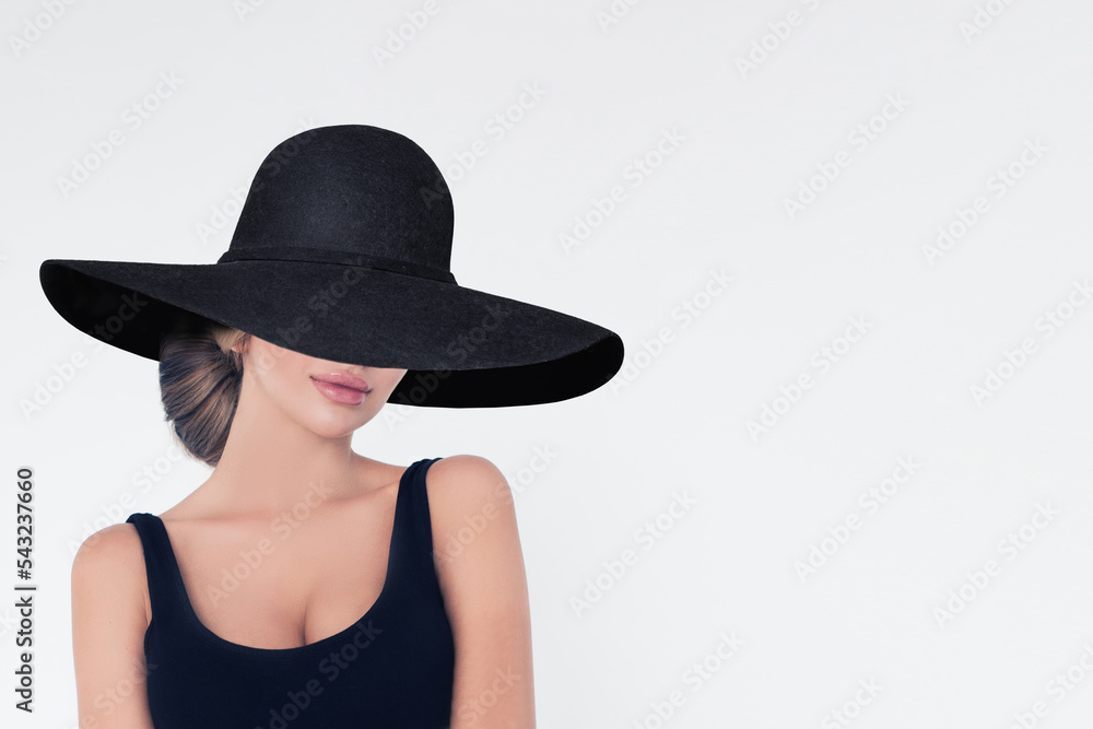 Portrait of beautiful pretty blonde woman in wide black briad brim hat on white banner background. Portrait of beautiful pretty blonde woman in wide black briad brim hat on white banner background.