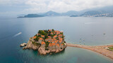 Historical part of Montenegro seaside is beautiful and romantic place of Sveti Stefan with long bridge heading to the old town standing on rock in sea. Wonderful landmark of Crna gora with beach, sea