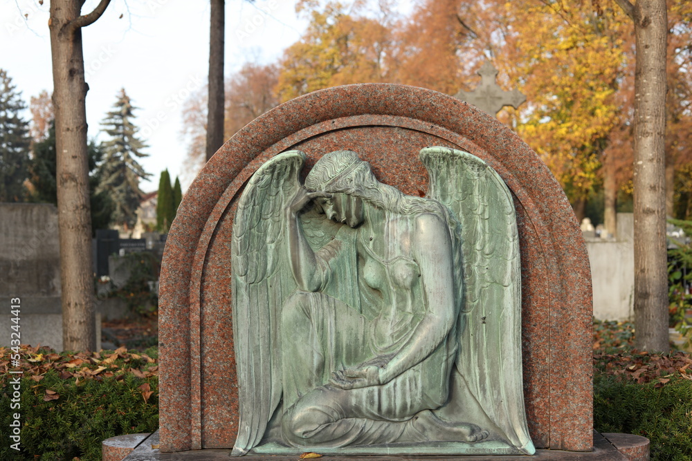 old stone angel in cemetery
