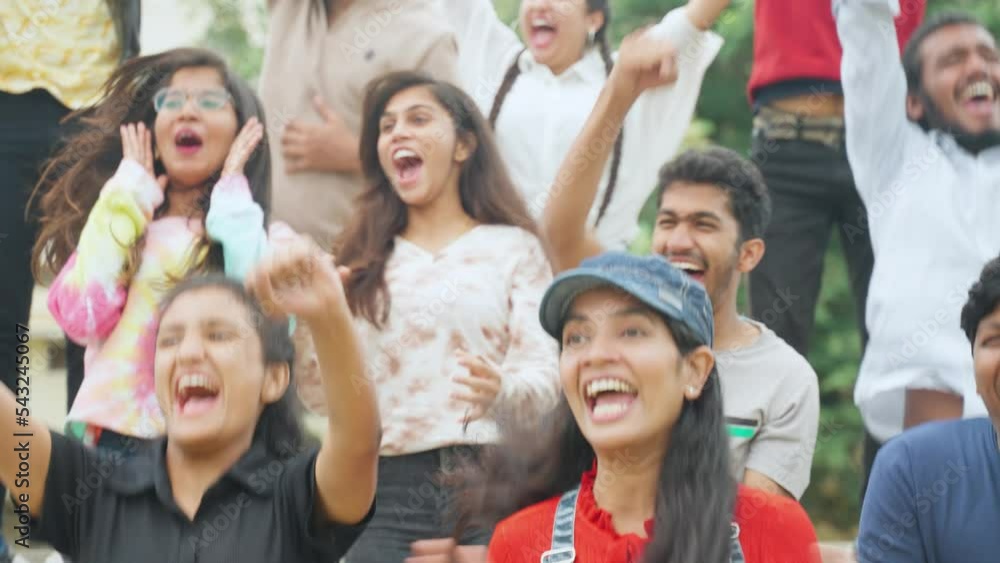 tensed girl excited and started celebrating with audience after win of match during interesting cricket match - concept of enjoyment, support and tournament tensed girl excited and started celebrating with audience after win of match during interesting cricket match - concept of enjoyment, support and tournament