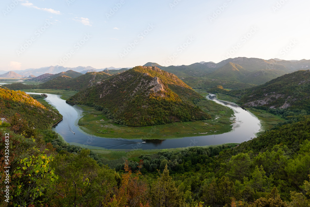 Skadar lake in Montenegro is beautiful place for photography. Pure landscape which looks like Vietnam part. Clean river and huge mountains. Water is covered by waterlily. Great location for holiday.