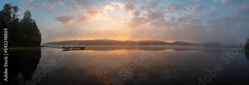 Fotografie Calm sunrise in misty lake