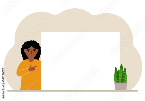 A girl points his finger at a clean large banner, a blank poster or a large white sheet of paper with space for text.