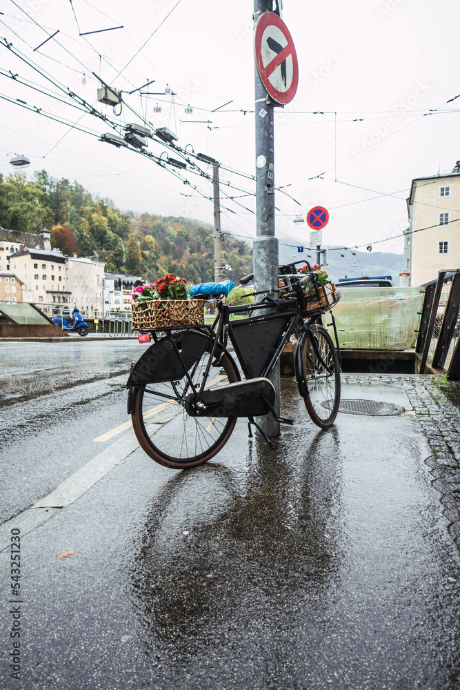 bike parked on a street lamp in salzburg