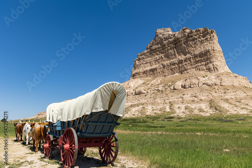 Covered wagon in front of Scotts Bluff National Monument, Gering, Nebraska, USA photo