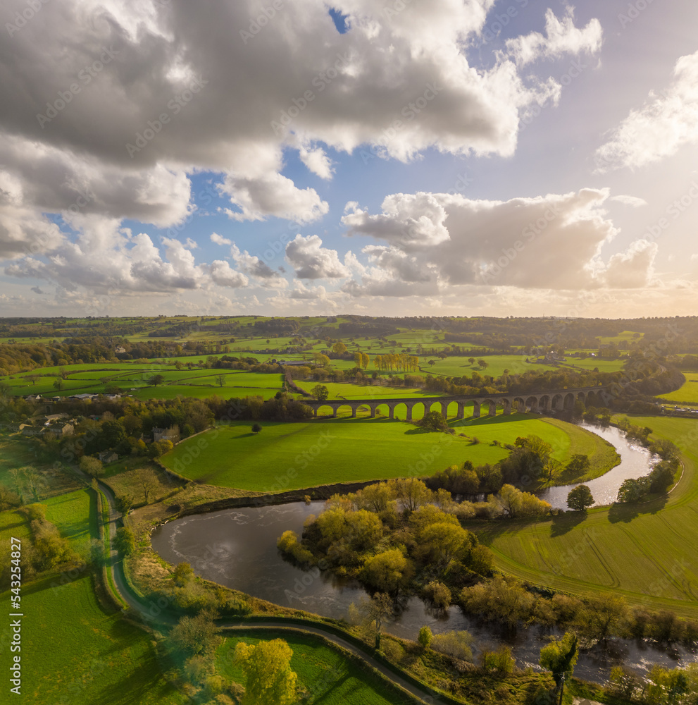 Aerial view over Arthington Viaduct and the River Wharfe on a sunny autumn day