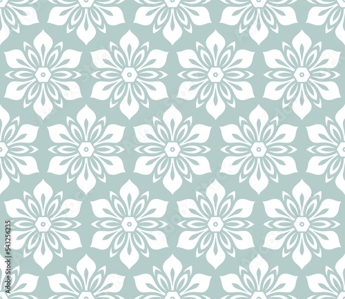 Floral white ornament. Seamless abstract classic background with flowers. Light blue and white pattern with repeating floral elements. Ornament for fabric, wallpaper and packaging
