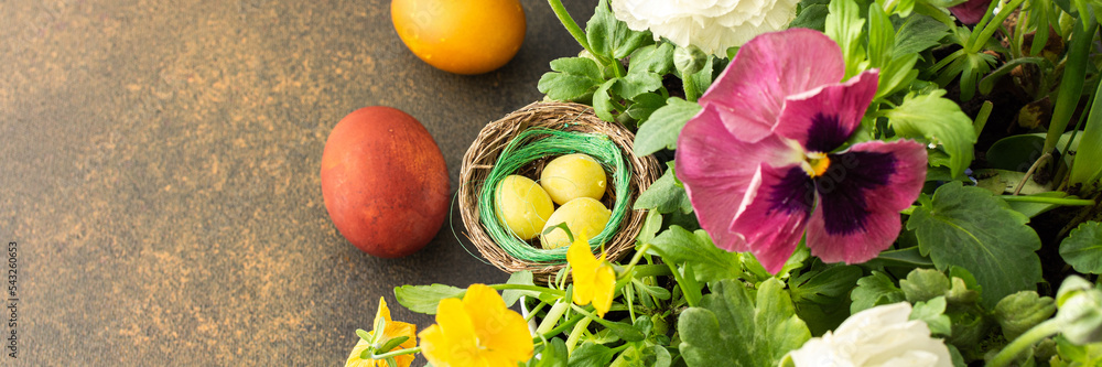 Top view of a vase with beautiful blooming flowers and Easter eggs, cute bunnies, copy space, Easter banner Top view of a vase with beautiful blooming flowers and Easter eggs, cute bunnies, copy space, Easter banner