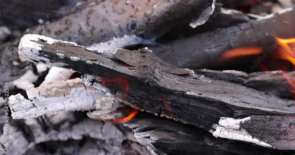 Burning logs and boards in the fire, kindling a fire for barbecue Burning logs and boards in the fire, kindling a fire for barbecue