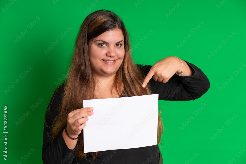 Young woman holding a empty white paper, Green Background Young woman holding a empty white paper, Green Background