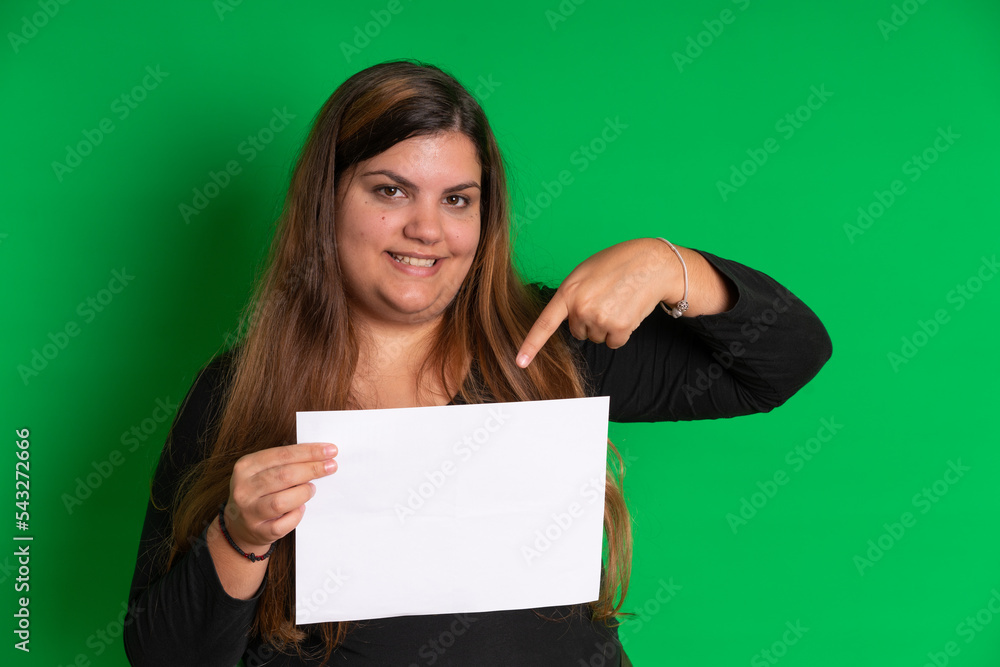 Young woman holding a empty white paper, Green Background Young woman holding a empty white paper, Green Background
