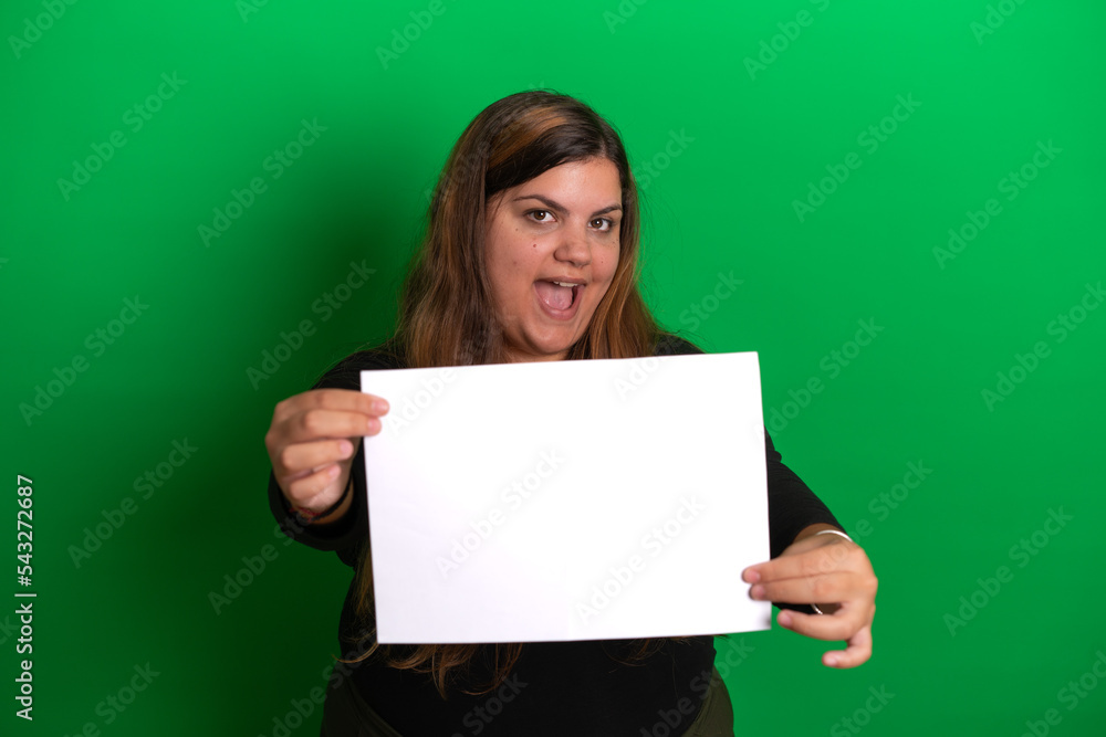 Young woman holding a empty white paper, Green Background Young woman holding a empty white paper, Green Background