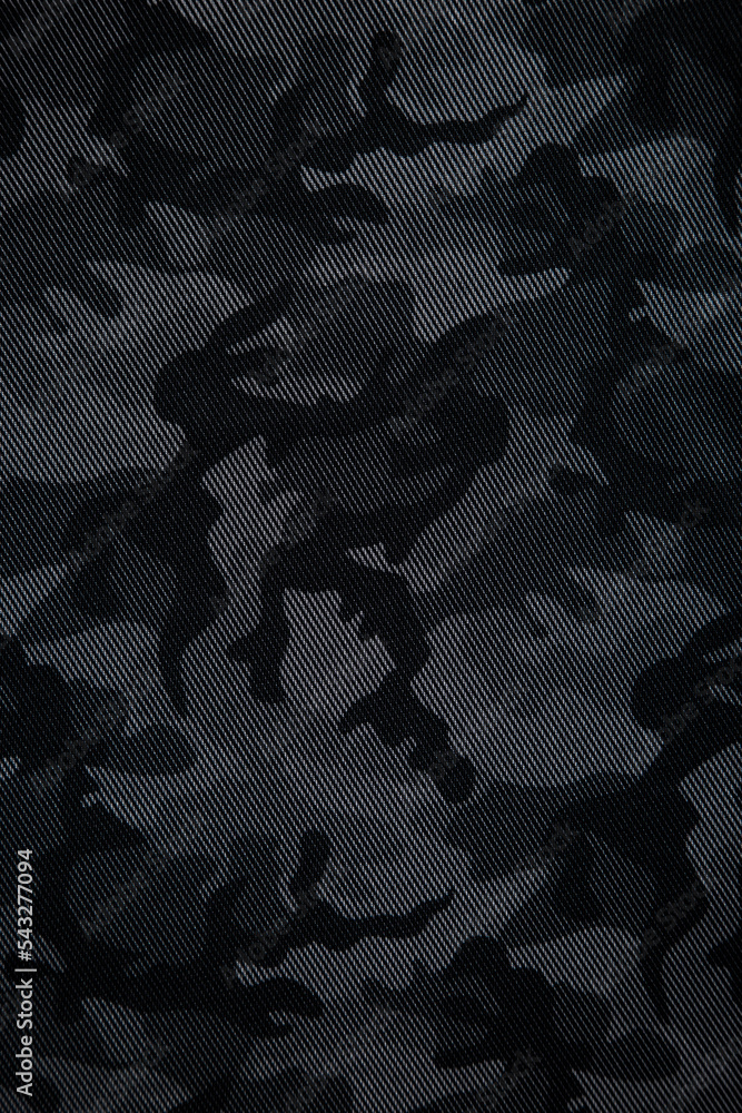 Camouflage pattern. Trendy dark gray camouflage fabric. Military texture.  Dark back. Stock Photo