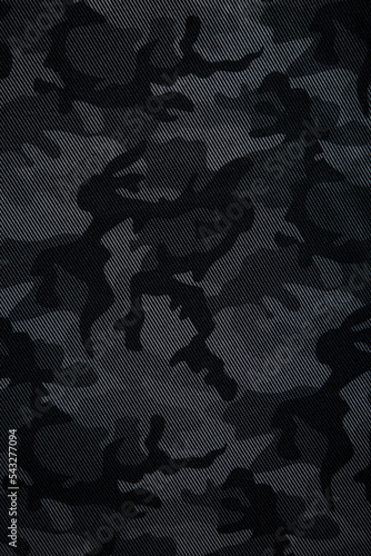 Camouflage pattern. Trendy dark gray camouflage fabric. Military texture. Dark back. photo