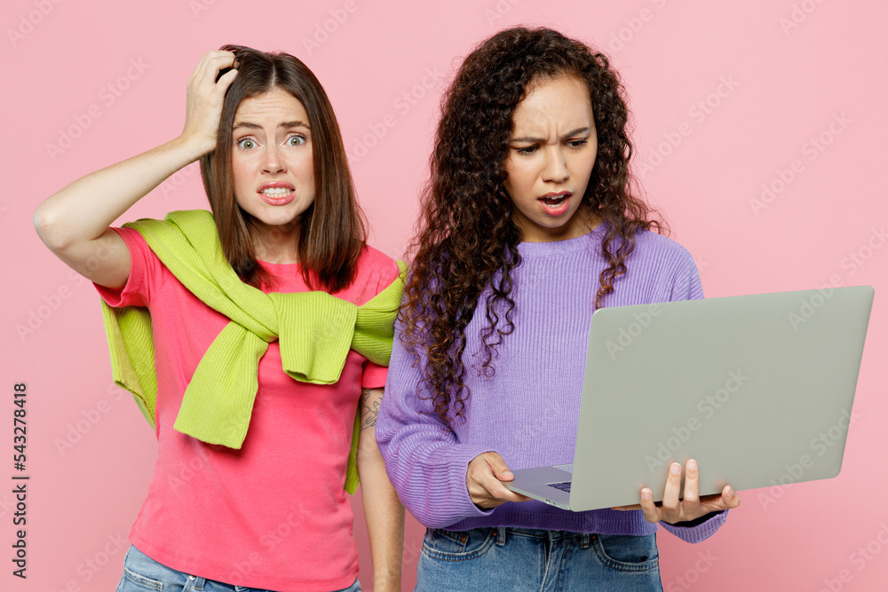 Young two friends shocked scared IT women wears green purple shirts ...