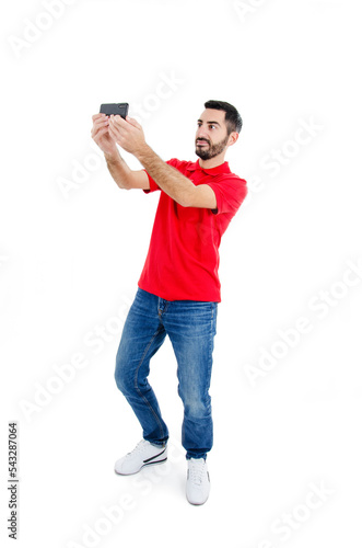 Caucasian man take selfie. Isolated on white background. Studio shot. Full length