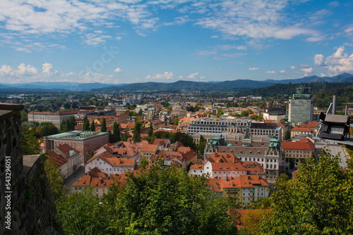 The city of Ljubljana in central Slovenia viewed from the historic castle on Castle Hill. Part of the castle walls can be seen on the left 