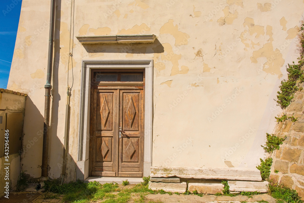 A side door in the historic St George's Parish Church in the medieval centre of Piran on the coast of Slovenia. Called Zupnijska Cerkev Sv Jurija in Slovenian, Renaissance Roman Catholic church 