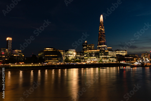 London city at night with reflections in the water