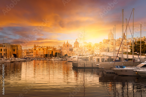 City of Birgu with Grand Harbour at sunset in Valetta, Malta photo