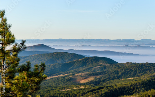 Autumn in the mountains with fog in the valleys