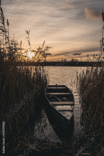 Plakat boat at sunset