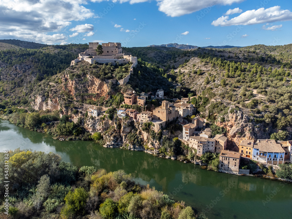 Aerial view of Miravet Castle in Catalonia, Tarragona province in Spain. with a view of the Ebro river next to the medieval town of Miravet