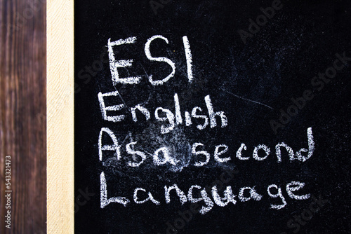 Foto Esl - English As A Second Language text concept on chalk board.