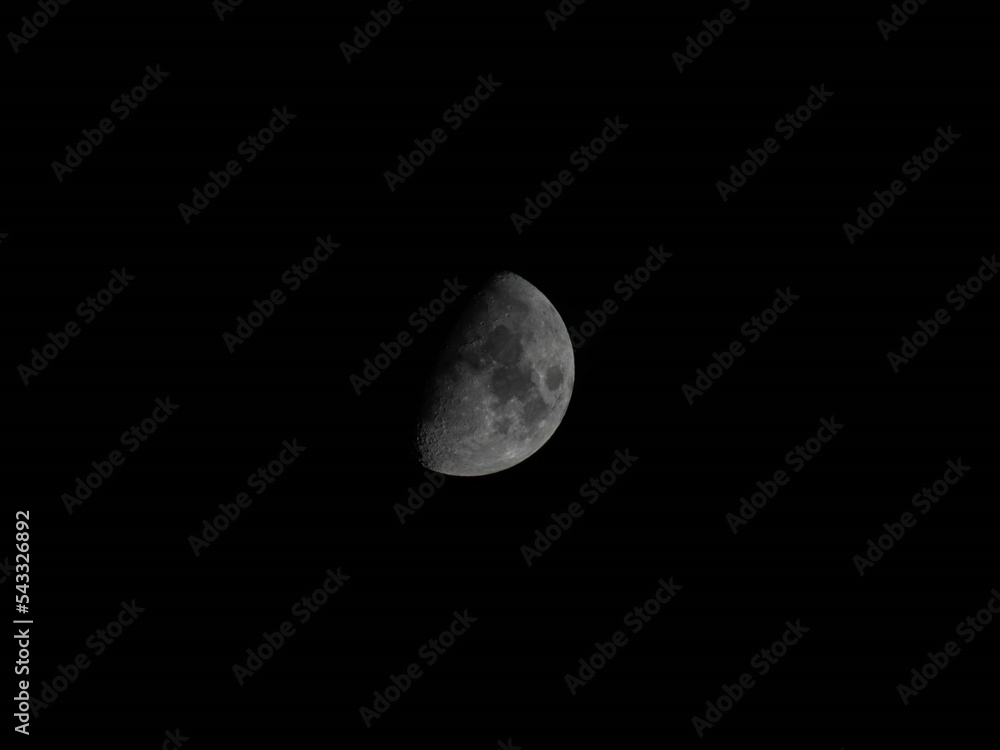 Half moon and its bright side seen from the Earth Half moon and its bright side seen from the Earth