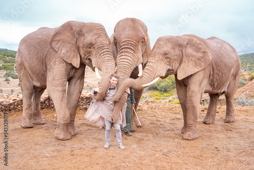 Photography Happy Man with 3 Elephants on Nature Safari in South Africa Game Reserve
