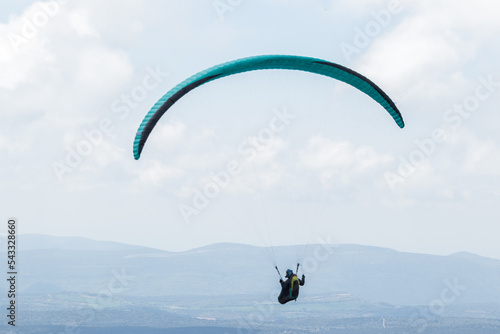 A paraglider flight in a blue sky with clouds.
Paragliding, paraglider, paraglider pilot, flying, fly