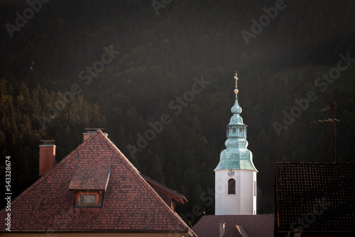 .Zupnijska Cerkev Svete Elizabete Ogrske church,a typical austro hungarian slovenian catholic church with its bul steeple clocktower in Ljubno ob savinji, in Slovenia.... photo