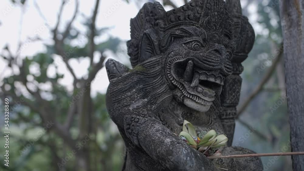 traditional balinese statue with offering traditional balinese statue with offering