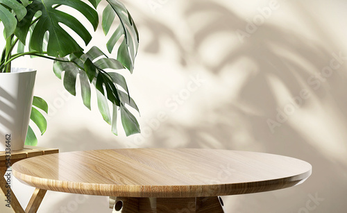 Wooden round side table with green tropical plant leaf and beautiful sun light and shadow on beige wall for luxury beauty, organic, health, cosmetic, jewelry fashion product display background photo