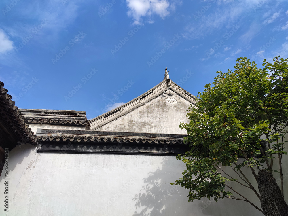 Chinese ancient architect with white wall under blue sky in sunny afternoon Chinese ancient architect with white wall under blue sky in sunny afternoon