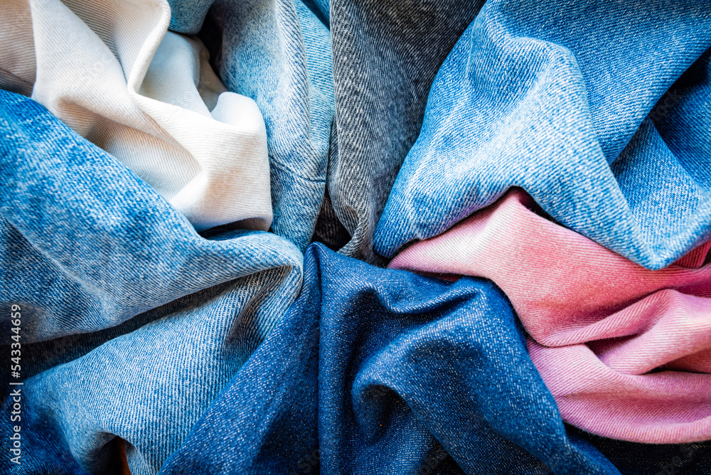 Varuous shades and colors of denim fabrics. Denim texture background.