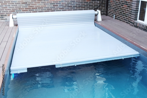 The protective covering for the pool which is rolled on a roller. Unique high-tech PVC lamellas