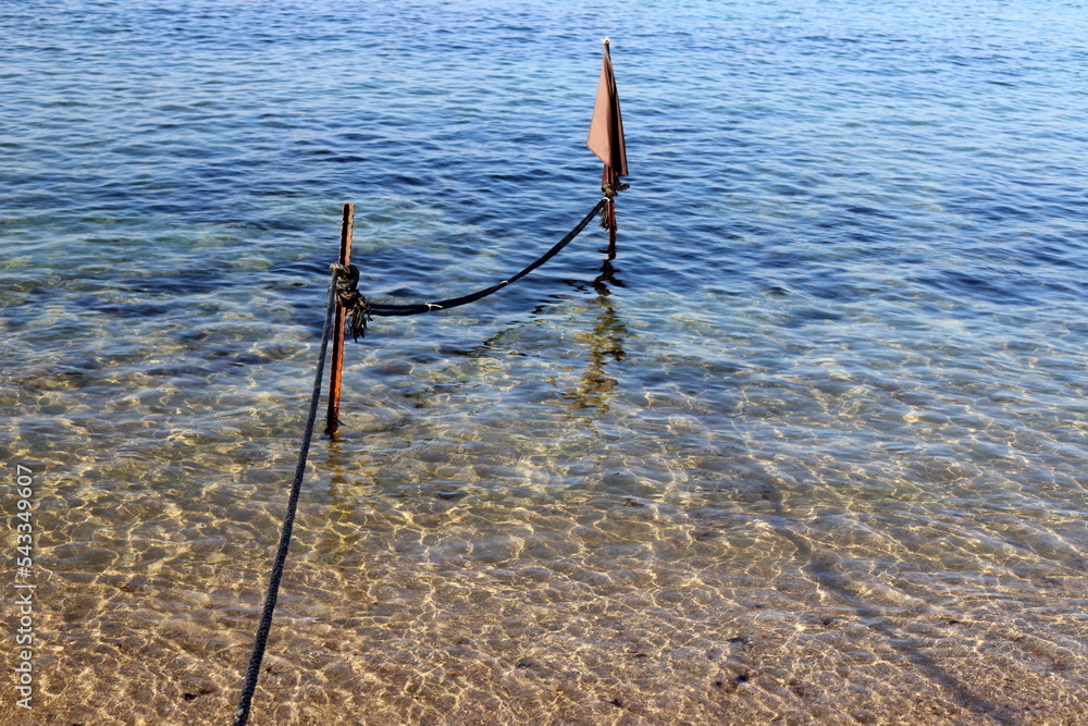 Hemp rope with buoys on the city beach