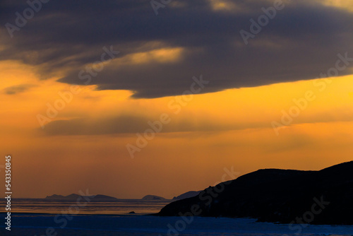 Picturesque sunset on Russky Island in Vladivostok. Sea sunset in winter. © alexhitrov