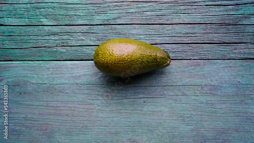 Avocado on wooden background