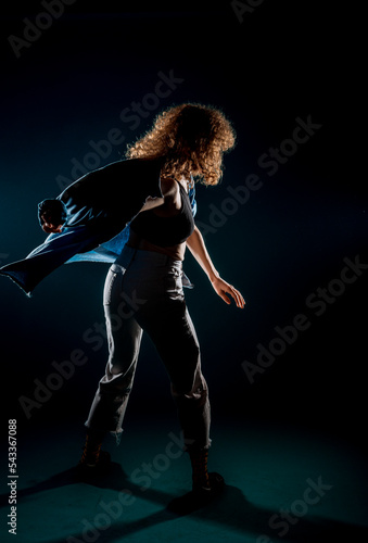 Contemporary style dancer on dark wall © qunica.com