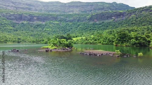 Aerial footage of the Green landscape surrounding the Solanpada Dam, Maharashtra, India at Jambrung village Karjat.